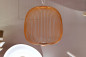 Preview: LED-Pendelleuchte Speiche Kugel aus kupfer-orange lackiertem Metall. Erhältlich im Möbelhaus Die Wäscherei - Das Möbelhaus in Hamburg.